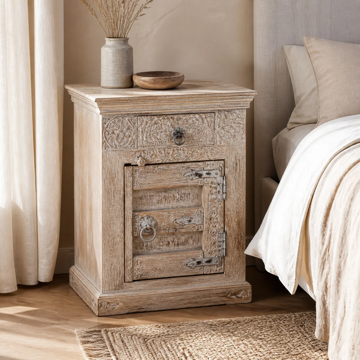 Omaheke Carved Bedside Cabinet staged in a quiet bedroom.